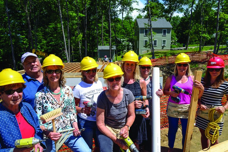 Members of the South Central Vermont Board of Realtors® Put Hammer to Nail. From left to right: Pat Delgiorno (Bean Group), Tuck Daniels, Annie Bessette (TPW Real Estate), Terry Hill (Mountain Realty), Carol Cantwell (William Raveis Winhall Real Estate), Carrie Matthews (William Raveis Winhall Real Estate), Claudia Harris (Mary Mitchell Miller Real Estate), Elyn Bischof (Mountain Realty), and Lauren Behm (Mountain Realty).