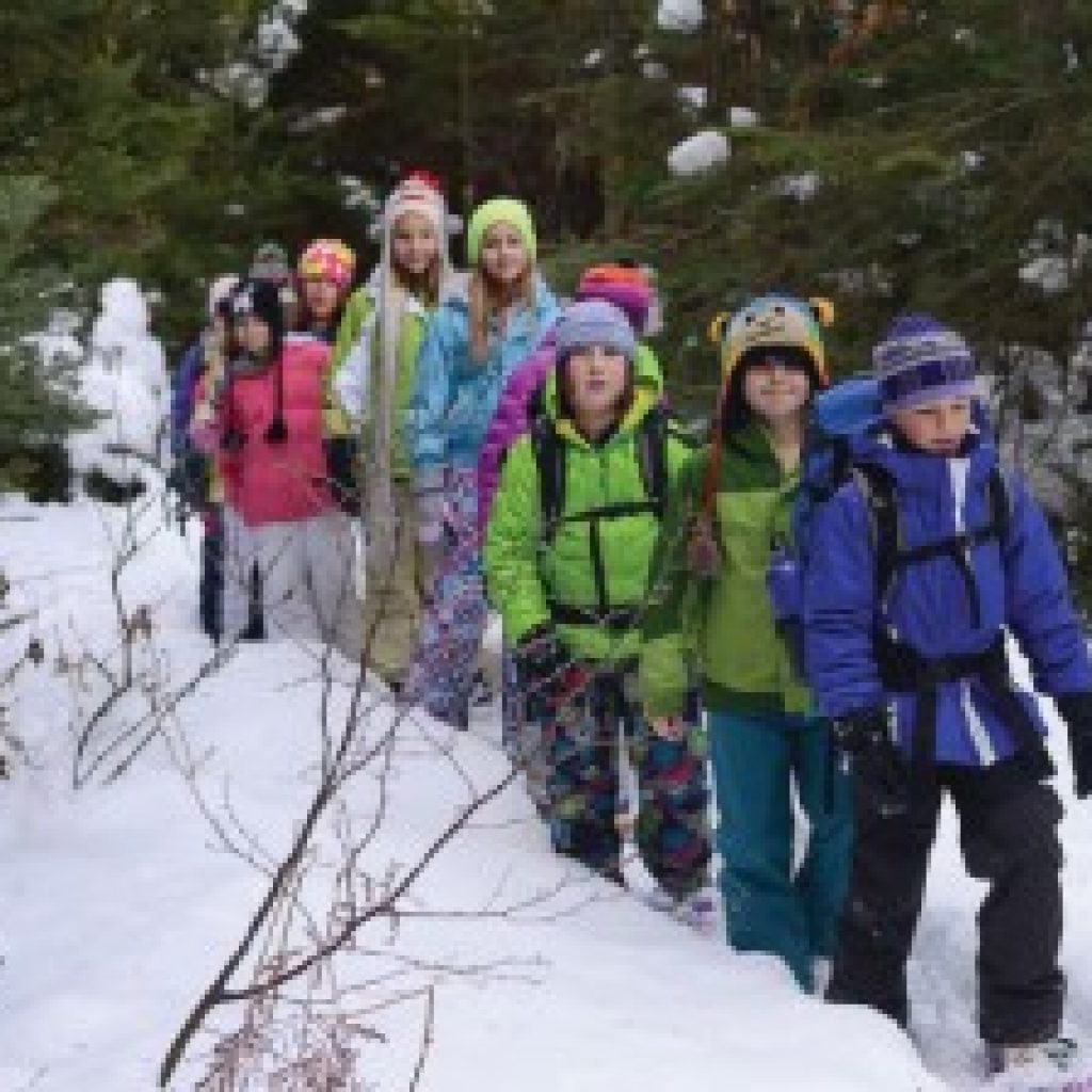 Group of Girls Hiking in Snow