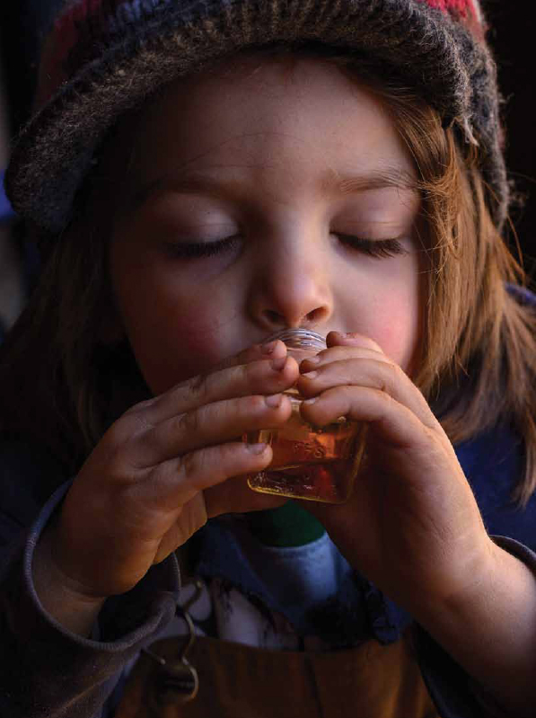 Child Sipping Maple Syrup