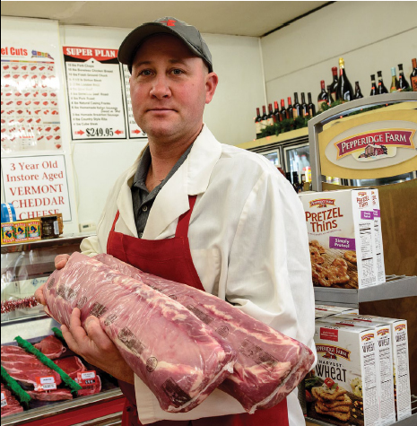 Some of Gene Guertin’s customers at Henry’s Market have been shopping there for more than 60 years.
