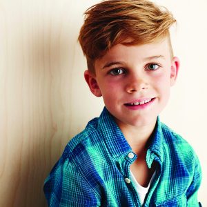 Portrait of young boy checked shirt, smiling