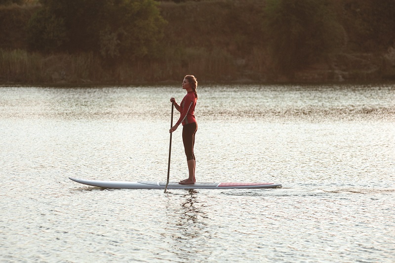 woman on stand up paddleboard