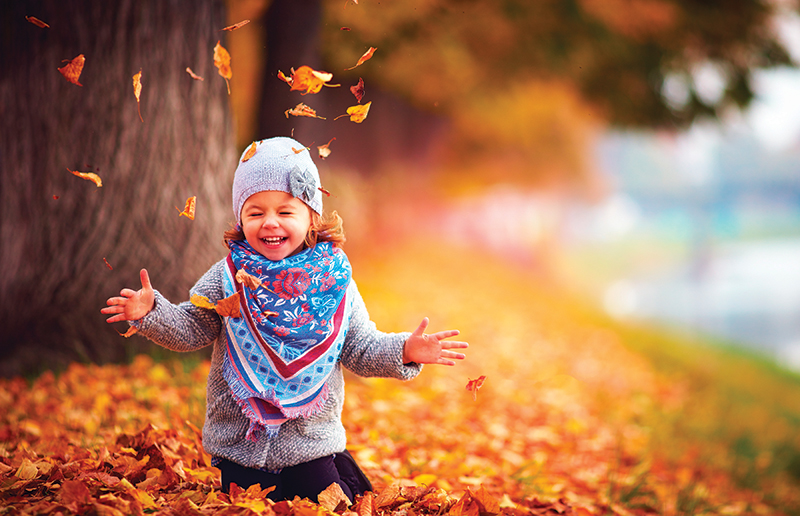 girl in leaves