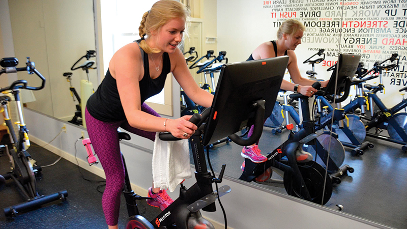 woman on spin bike stratton mountain fitness center