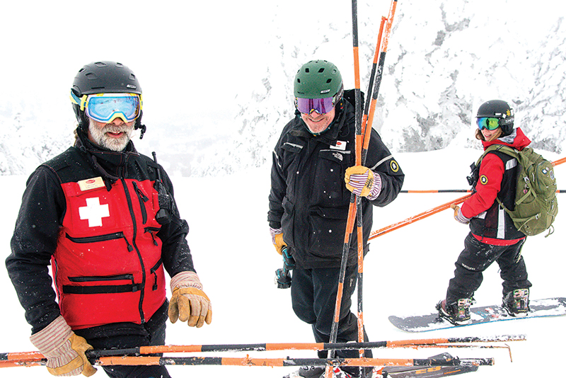 ski patrollers on the trails at stratton mountain